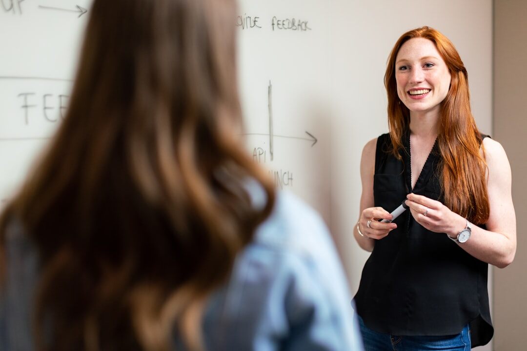 woman presenting to colleagues